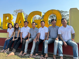 Common Health's Bago, Myanmar field team in front of Welcome to Bago sign